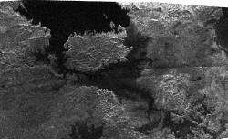 Dark features thought to be lakes of liquid methane appear in this radar image of Titan